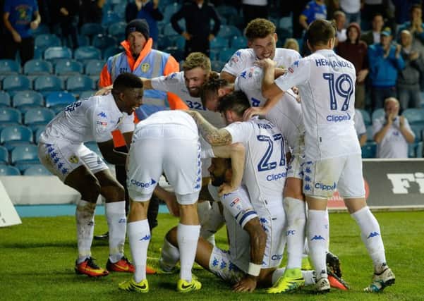Leeds United's players celebrate Kyle Bartlett's match-winning goal against Blackburn Rovers .  Picture: Bruce Rollinson.