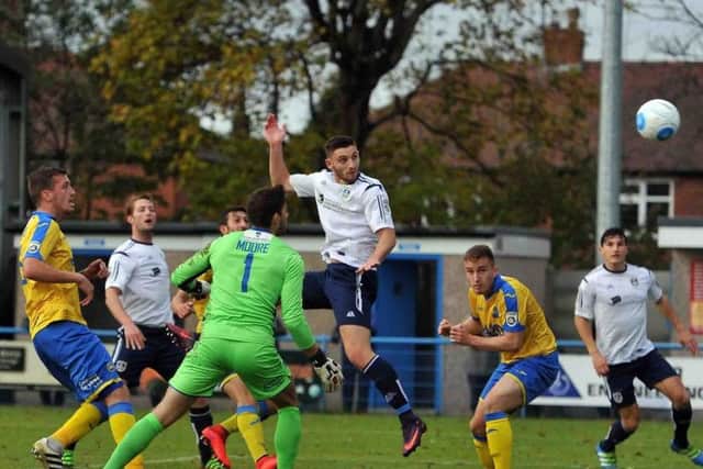 Jake Cassidy scoring Guiseley's second against Torquay