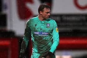 HARD TIMES: Sheffield Wednesday goalkeeper David Stockdale covered in mud at Cheltenham on Wednesday night. Picture: Simon Marper/PA