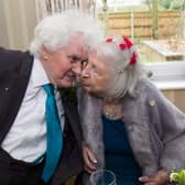 Joan Neininger & Ken Selway share a kiss at their wedding reception at Hannover Court, Cinderford, Gloucestershire. 