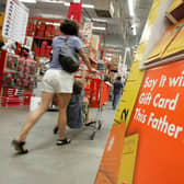 A Home Depot customer walks by a display of Father’s Day gift cards. (Pic credit: Justin Sullivan / Getty Images)