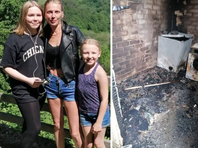 Kelly Feaviour and her daughters, and the burned-out tumble dryer Picture SWNS 