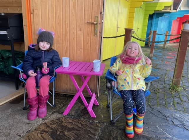 Katy’s children drinking hot chocolate at the chalet on New Year’s Day