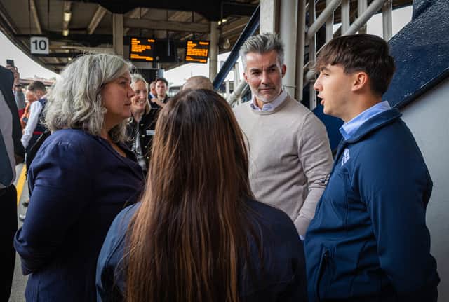 Transport Secretary Heidi Alexander, left, and York and North Yorkshire Mayor David Skaith, centre, talk to TransPennine Express staff after travelling from Leeds to York on newly electrified track from the Transpennine Route Upgrade. Credit: DfT/Flickr