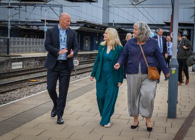 TransPennine Express managing director Chris Jackson, left, West Yorkshire Mayor Tracy Brabin, centre, and Transport Secretary Heidi Alexander, right, in Leeds Station ahead of the first train departing on the newly electrified Transpennine Route Upgrade track to York. Credit: DfT/Flickr