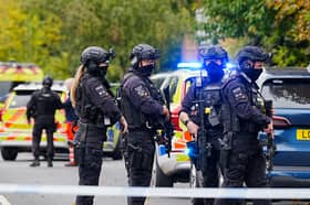 Armed police officers at the scene near the Heaton Park Hebrew Congregation synagogue in Crumpsall, Manchester. Credit: PA