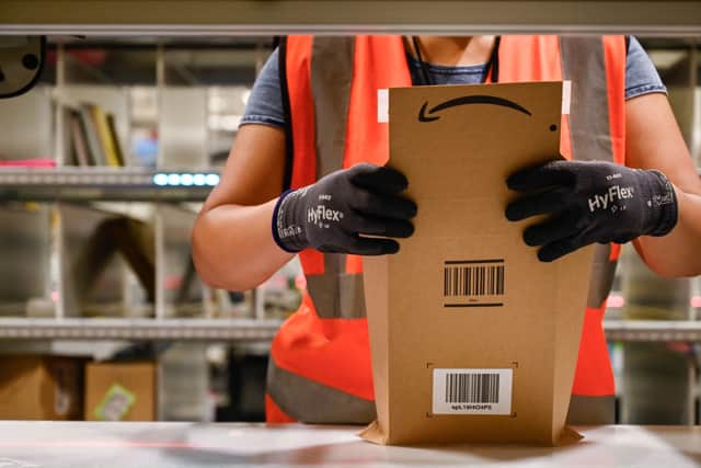 An Amazon employee prepares an order. The company is hiring over 15,000 seasonal workers across the UK ahead of the festive rush (Photo: SEBASTIEN BOZON/AFP via Getty Images)