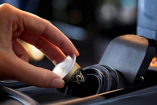 You get a handful of free pods with the machine, and it's compatible with Nespresso capsules