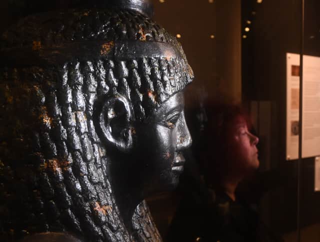 Profile perfect: Prof Joann Fletcher with a replica of the famous granite bust of Cleopatra VII, famed for its intricate braided hair and royal headpiece.