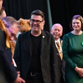 Andy Burnham laughs at being placed next to Binface and a man dressed as a fox, Andy Burnham Makerfield MP - Makerfield by-election count at The Edge, Wigan.