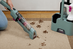 The cordless Shark StainForce comes with a storage caddy, two attachments and two 500ml bottles of cleaning solution