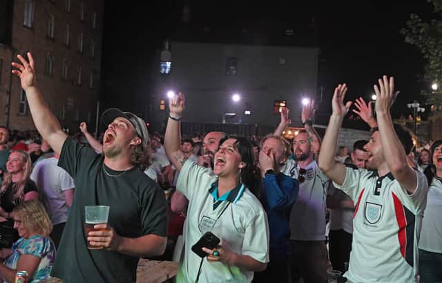 Fans celebrate an England goal