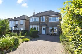 The impressive frontage reflects the generous scale of this substantial detached family home set on a private plot.