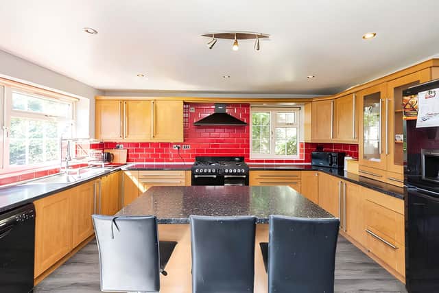 A contemporary kitchen with a central island provides a practical and sociable hub for everyday family life.