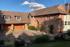 Behind private gates, this substantial village home makes a striking first impression in a secluded setting.