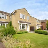 The detached Oakdene Way home occupies a discreet cul-de-sac position with a gated driveway leading to its detached garage