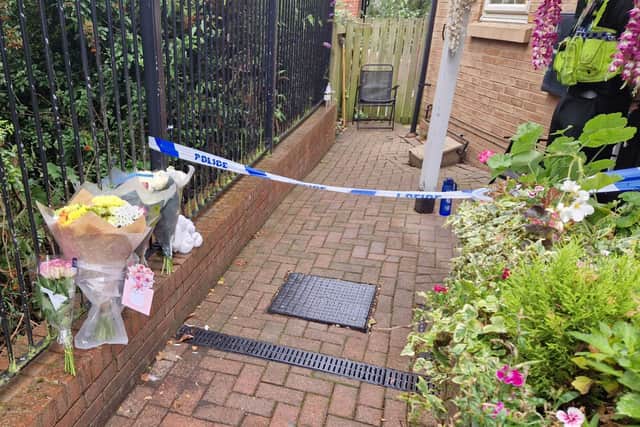 Bouquets of flowers have been left on Holywell Heights in Wincobank after the murder of a newborn baby