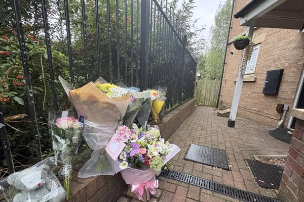 Flowers left at the scene in Holywell Heights, Sheffield
