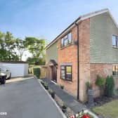 The Manor Close property sits on a generous plot with ample driveway parking and access to its detached garage