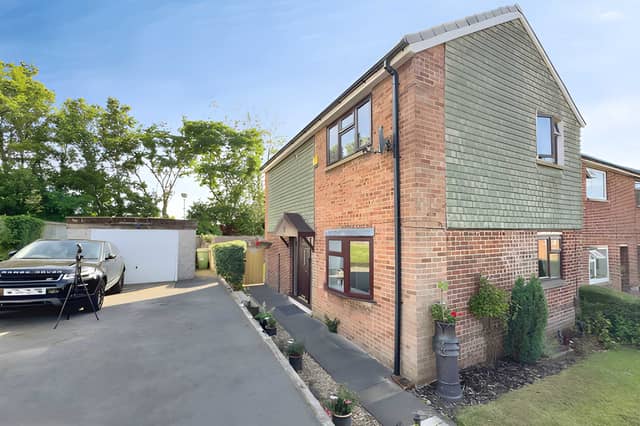 The Manor Close property sits on a generous plot with ample driveway parking and access to its detached garage