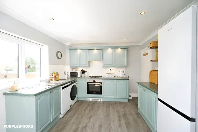 The spacious kitchen diner provides a practical setting for family meals and entertaining