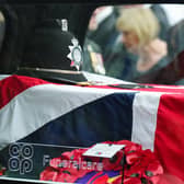 A police hat lay on top of Pc Tom Clough’s coffin (Owen Humphreys/PA)