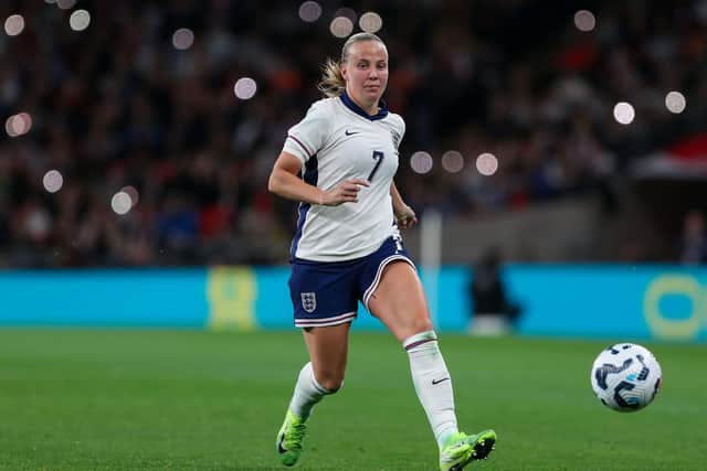Beth Mead kicking a football wearing an England kit (Alamy/PA)