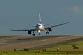 A plane aborts landing and performs a go-around in strong winds at Leeds Bradford Airport on Friday.