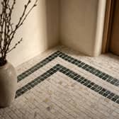 ROMAN LUXURY Lapicida’s Calacatta Gold Marble Mosaic creates an elegant statement floor with contrasting Verde Guatemala detailing.