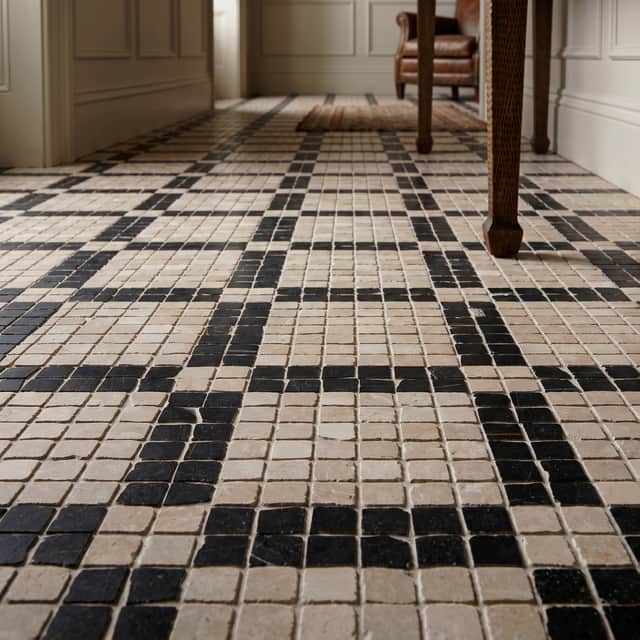 STATEMENT FLOOR: Lapicida’s Botticino Marble Mosaics create an intricate geometric floor inspired by centuries of Roman design.