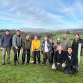 Some of the team taking part in tree planting volunteering in a local woodland,  funded by Beyondly for its 20th anniversary. 