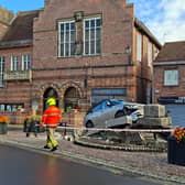 A Range Rover has mounted a paved area and knocked down the Market Cross in Howden,
