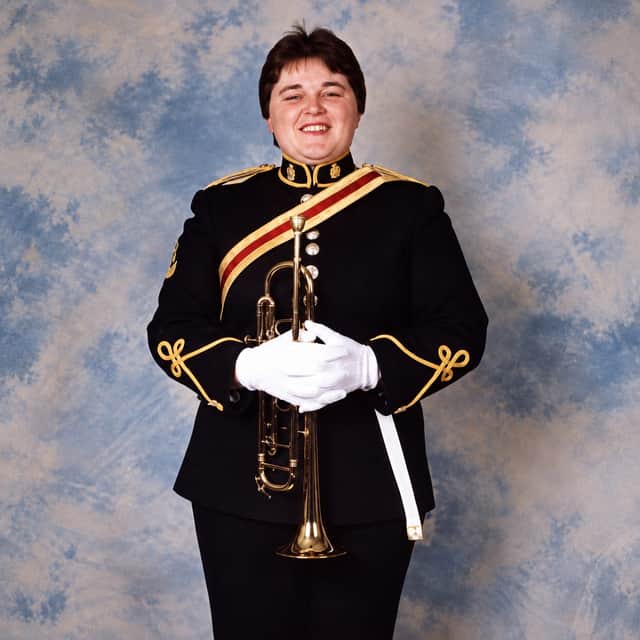 Louise Lingard-Snape, from Barnsley, in the Band of The Royal Logistics Corps 1996, smiling amidst the bullying. Credit: Louise Lingard-Snape