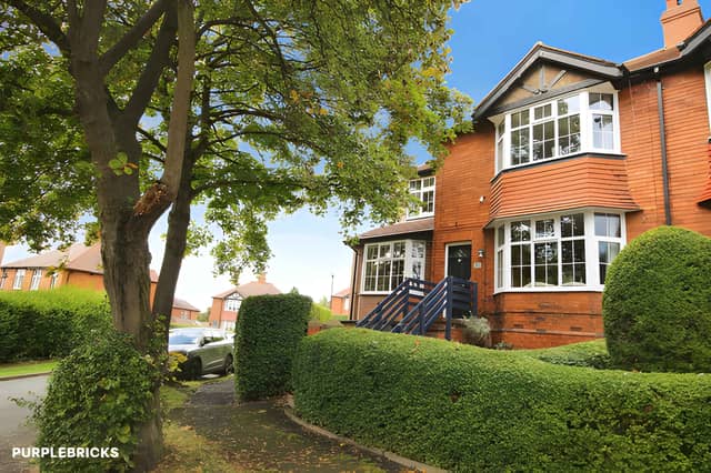 The Sandybank Avenue home has a low-maintenance pebbled front area and a generous block-paved driveway