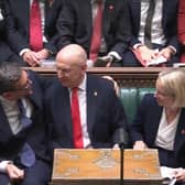 Prime Minister Andy Burnham congratulating Chancellor of the Exchequer John Healey after delivering his Budget in the House of Commons
