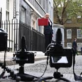 John Healey poses for the media in advance of his Budget