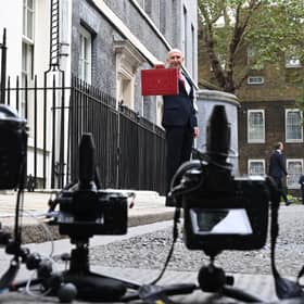 John Healey poses for the media in advance of his Budget