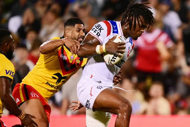 Dominic Young of England attempts to break a tackle during the rugby league World Cup game between England and Papua New Guinea in Wollongong, Australia, Friday, Oct. 30, 2026.