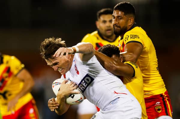England are heading out of the World Cup despite beating Papua New Guinea 34-12.