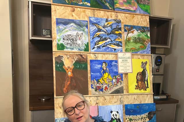 Resident Alison Walker with her stall selling her own artwork
