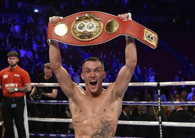 Josh Warrington shows off his IBF Featherweight title belt after his stunning second-round stoppage of Sofiane Takoucht. Picture: Steve Riding.