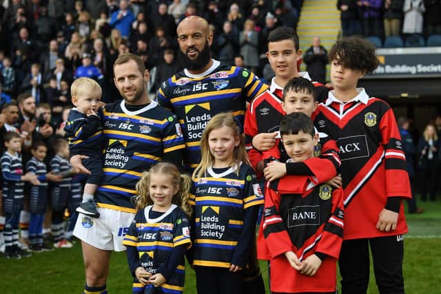 Leeds Rhinos legends Rob Burrow and Jamie Jones-Buchanan are pictured at the testimonial match with their children.
Picture: Jonathan Gawthorpe.