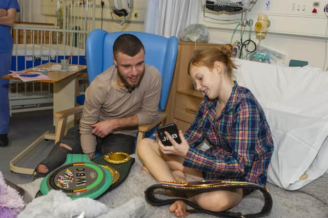 Tommy Frank is pictured with heart patient Amelia Brown, 12, from Skipton during his visit to the Leeds Children's Hospital. 
Picture: Tony Johnson.