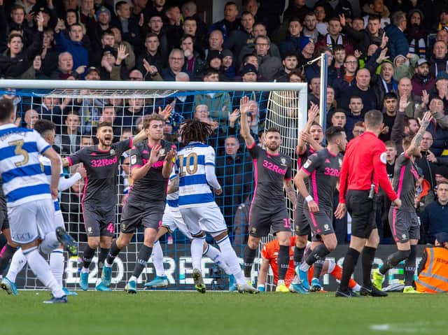 Leeds United's players appeal following QPR's controversial opener. (Pic: Bruce Rollinson)