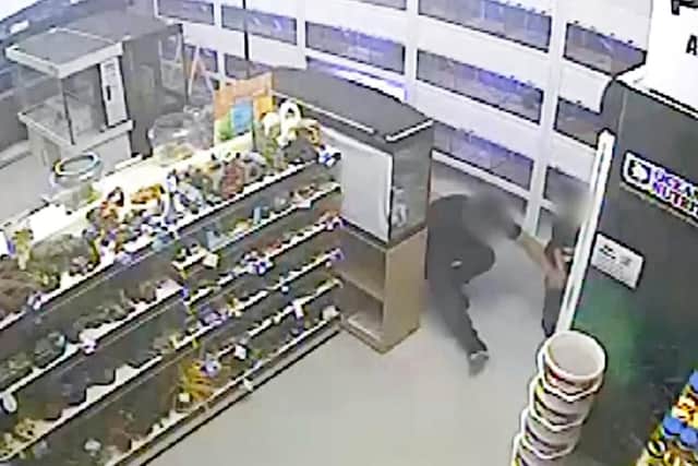 Stills from the CCTV taken in a Leeds pet shop which show Khan faking a fall for which he tried to claim compensation. Images supplied by City of London Police