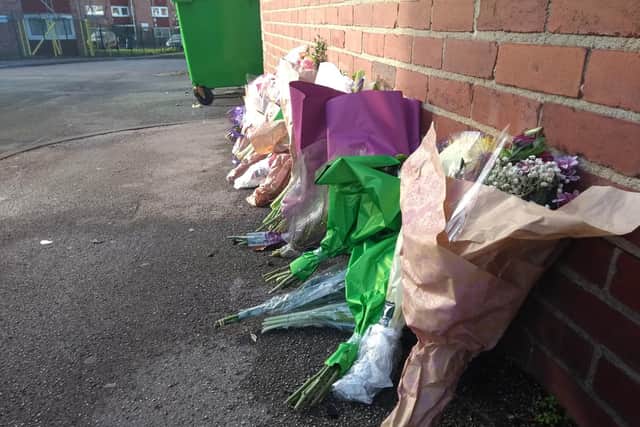 Floral tributes near to the crash scene in Garforth following the death of Kathleen Wilkinson.