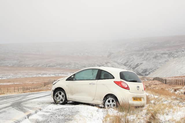 A car trapped at Snake Pass in Derbyshire as Storm Dennis heads north this weekend. Picture: Danny Lawson/PA