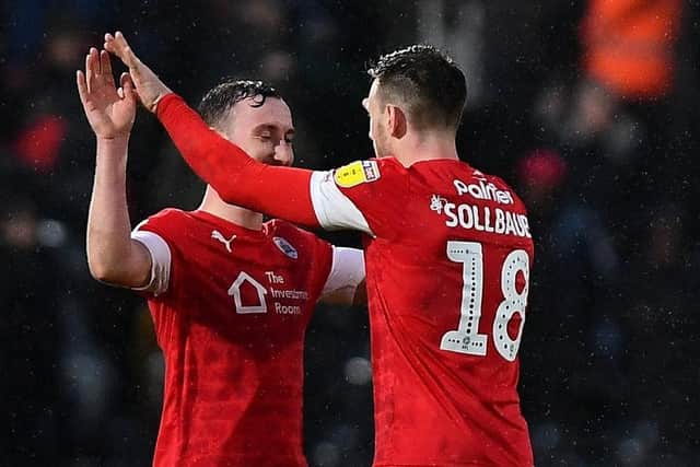Important win: Barnsley's Michael Sollbauer celebrates victory at Fulham.