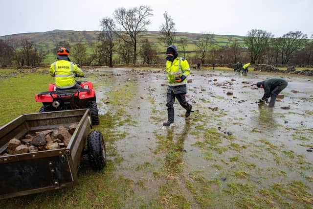 Volunteers helping the Yorkshire Dales National Park Authority repair flood damage in Swaledale.