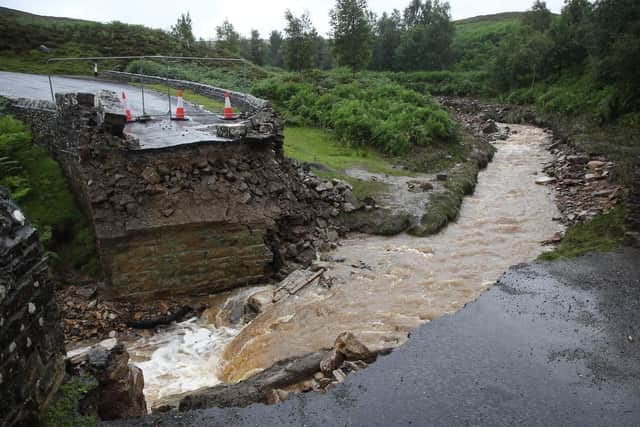 The collapsed bridge following heavy rainfall on Grinton Moors. Photo credit: SWNS